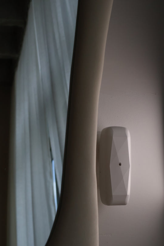 Chateau Jewel Plug-In Diffuser and Cold-Air Scent System mounted on wall, showing its elegant minimalist design and luxury fragrance performance for small spaces